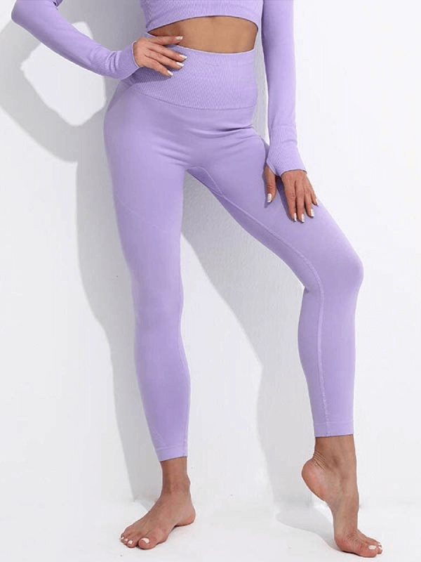 Women's seamless high waist yoga leggings in lavender, offering full coverage, comfort, and mobility for yoga and active wear.